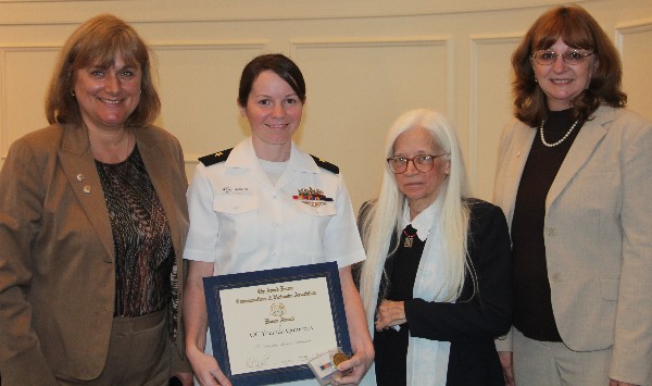 Duvall (l) and Mary Yager (r), chapter vice president for education, attend the Hampton Roads Navy ROTC Ceremony in April, where they present the AFCEA ROTC Honor Award to officer candidate Yolanda Quinones, Navy ROTC, while Dr. Linda L. Vahala, associate dean, Frank Batten College of Engineering and Technology, stands witness.